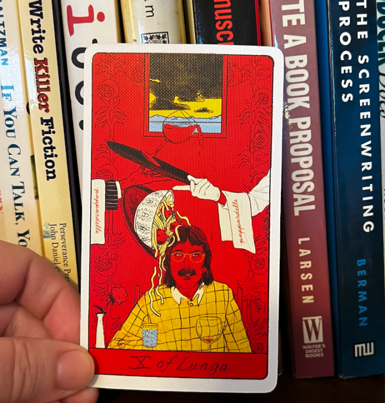 Hand holding a Ten of Swords tarot card